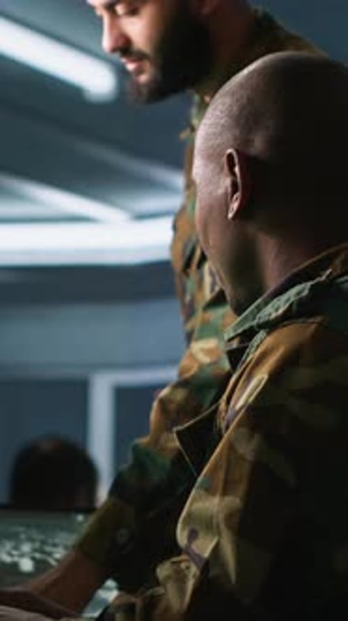 Vertical Video Experts Using Tracking Gear and Radar Systems in Command Center