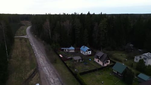 A Forest Village with Water Building Sky and Tree From Above
