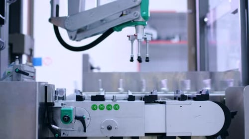 Pharmaceutical Manufacturing Line. Robotic Arm at Pharmaceutical Plant. Pharmacy Factory Conveyor Be