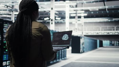 Computer Scientist Doing Data Center Automation Using AI on Laptop