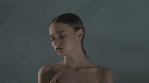Elegant Young Woman Posing in Studio