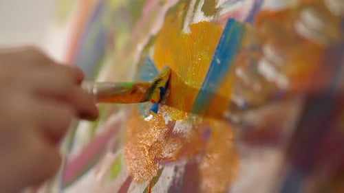 Art Therapy in Psychology Closeup View of Paintbrush in Artist Hand and Canvas Painter Applying