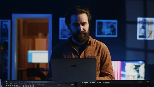 Portrait of Smiling Developer Writing Complex Binary Code Scripts on Laptop