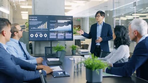 Business Team Meeting With Presentation in Modern Office