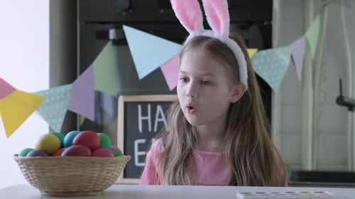 Funny Kid with Bunny Ears Play Easter Hare Hunter at Home