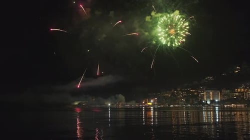 Fireworks with Colorful Lights Over Sea
