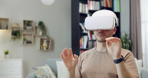 Man Using Virtual Reality Headset at Home