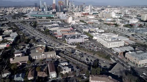 Downtown Los Angeles California skyline overhead at twilight flying aerial drone