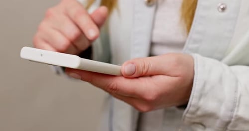 Female Hands Using Smartphone Tapping Scrolling Watching Video Content