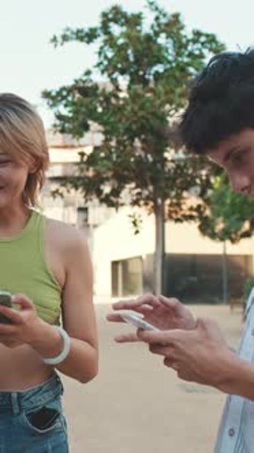 Young Adults Using Smartphones in Urban Setting