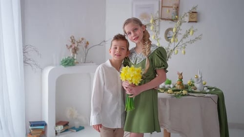 Boy and Girl Posing With Yellow Flower Bouquet