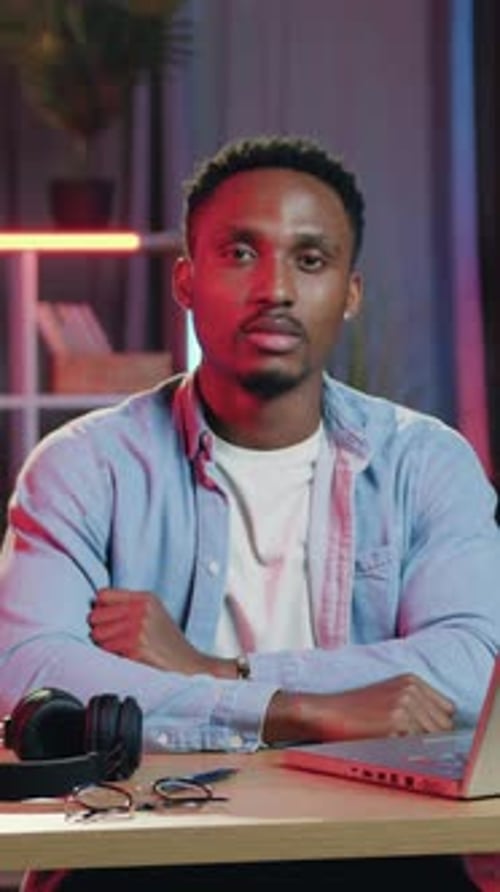 Young Adult Man with Arms Crossed Indoors Portrait