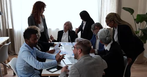 Multiracial Business People Working Inside Bank Office - Meeting and Startup Concept Analysis