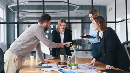 Power management in wind turbine company. Business people are working in the office.