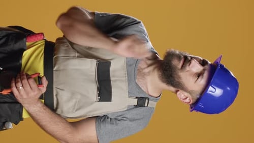 Vertical Video Construction Worker Brainstorming Ideas to Work on Rebuilding