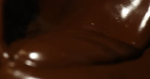 Close-up Chocolate Swirls and Ripples of Melted Chocolate