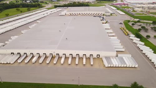 Distribution center aerial view with multiple loading docks and trucks in Georgetown Kentucky, USA