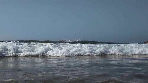 Slow motion shot of a wave rolling towards the camera.