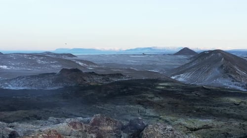 Extreme wild uninhabited volcanic landscape with dormant volcano, aerial