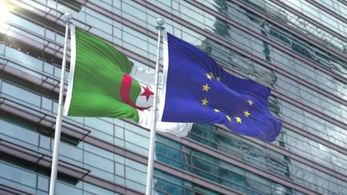 Algeria and European Union Flags Waving Against Modern Office Building