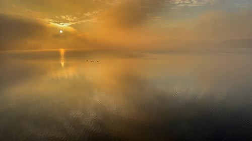 A Beautiful Sunset Reflected in the Calm Surface of the Lake
