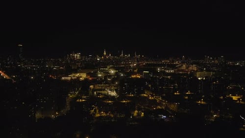 Forwards Fly Above Metropolis at Night