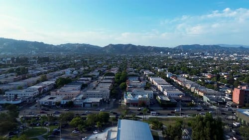 Drone aerial landscape of commercial buildings shops residential suburbs town of LA Los Angeles Holl
