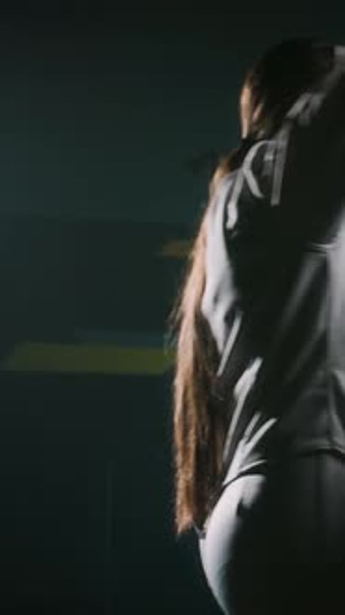 Vertical of Young Swordswoman Taking Foil Sword Before Training