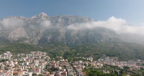 Aerial shot of Makarska with Biokovo Mountains in the background, Croatia