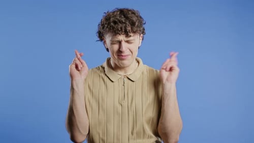 Young Adult with Crossed Fingers for Luck