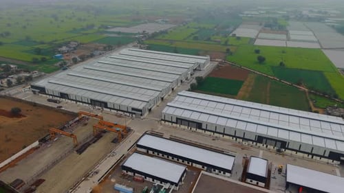 Aerial View Of Large Industrial Warehouses And Production Facilities