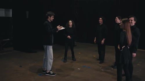 Group of Actors Rehearsing on a Theater Stage