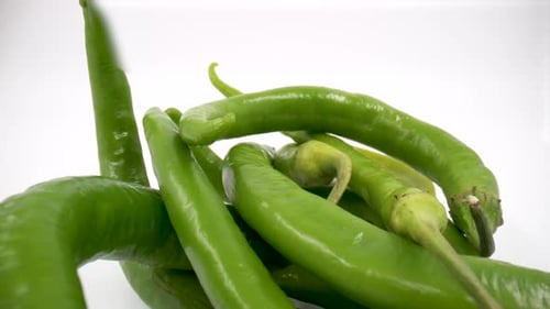 Green chili peppers close up isolated 4K