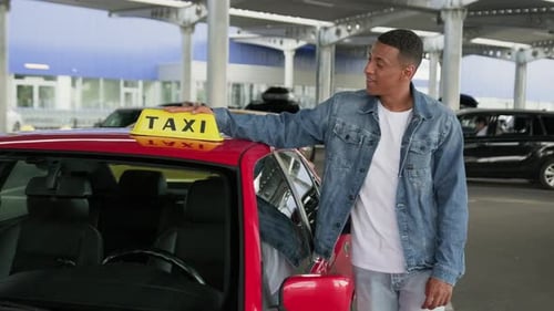 Man Puts Taxi Sign on Red Car, OK Sign