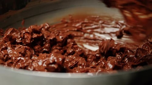 Chef Confectioner Making Chocolate with Nuts Dry Fruits Closeup Cooking Desserts Bakery and Candy