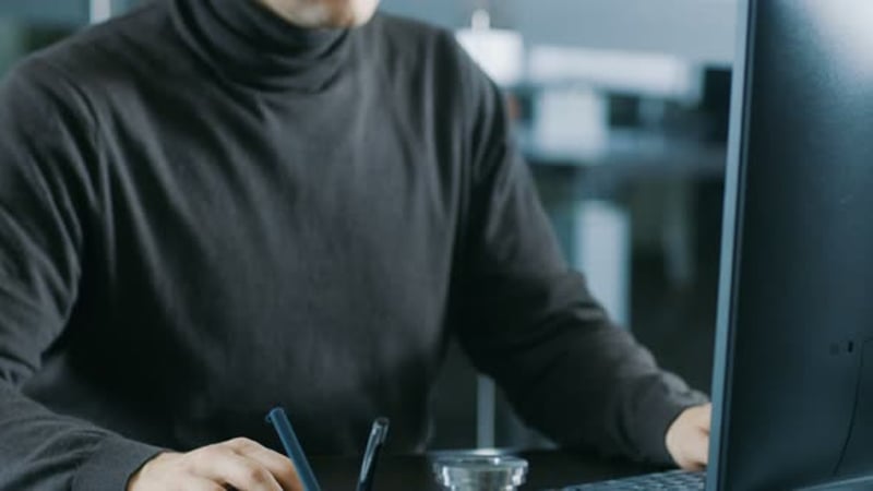 Experienced Industrial Engineer Working on Personal Computer in the ...