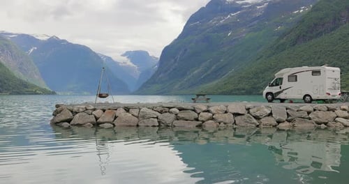 Family vacation travel RV, holiday trip in motorhome. Beautiful Nature Norway natural landscape.