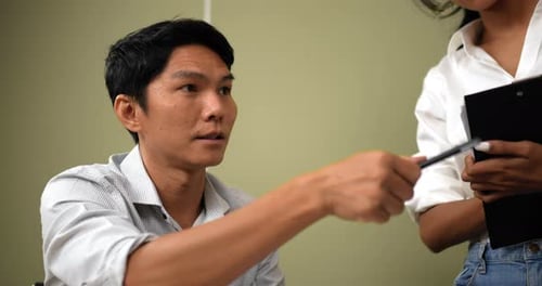 Young Adults Collaborate in Office and Celebrate Success