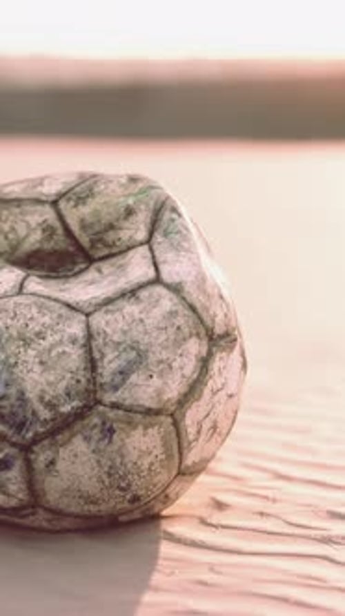 Very Old Soccer Ball on the Playground