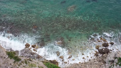 Aerial View Drone Camera Top Down of Seashore Rocks in Ocean Amazing Sea Waves Crashing on Rocks