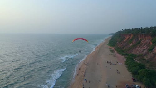 Paragliding in the beach of varkala cliff,.Kerala
