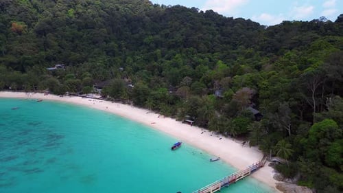 Lagoon jetty on Besar Perhentian island. Gorgeous aerial view flight drone