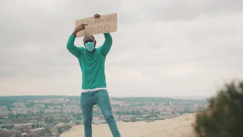 Unemployed Doctor with Strike Banner Fighting for Employment on Mountain Top Due to Quarantine