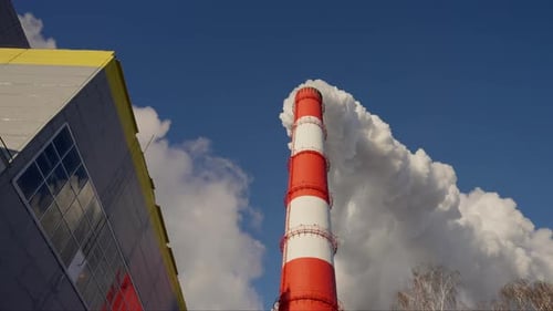 Coal Station Chimney Environmental Pollution Lower Angle Smoke on the Background of a Blue Sky