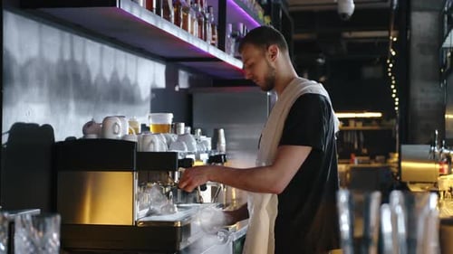 Man Cleaning Stem Glass at Urban Cafe Bar