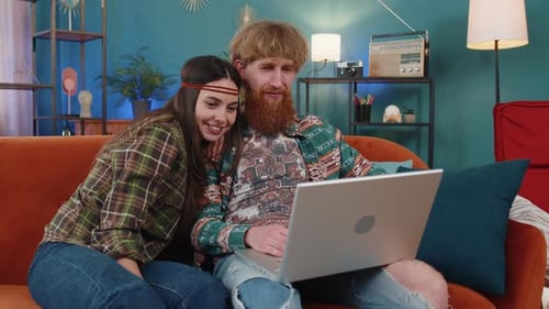 Couple Enjoying Video Call on Laptop at Home