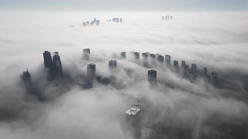 City Buildings Emerging Through the Fog Aerial View