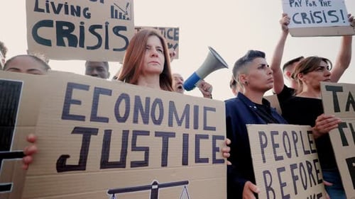 Multiethnic people protest for financial crisis on the streets - Crowd march for global inflation