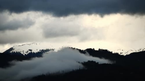 Snowy Mountains and Cloudscape in Overcast Weather