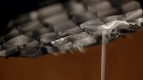 Smoke is drawn into the cooker hood, smoke removal process